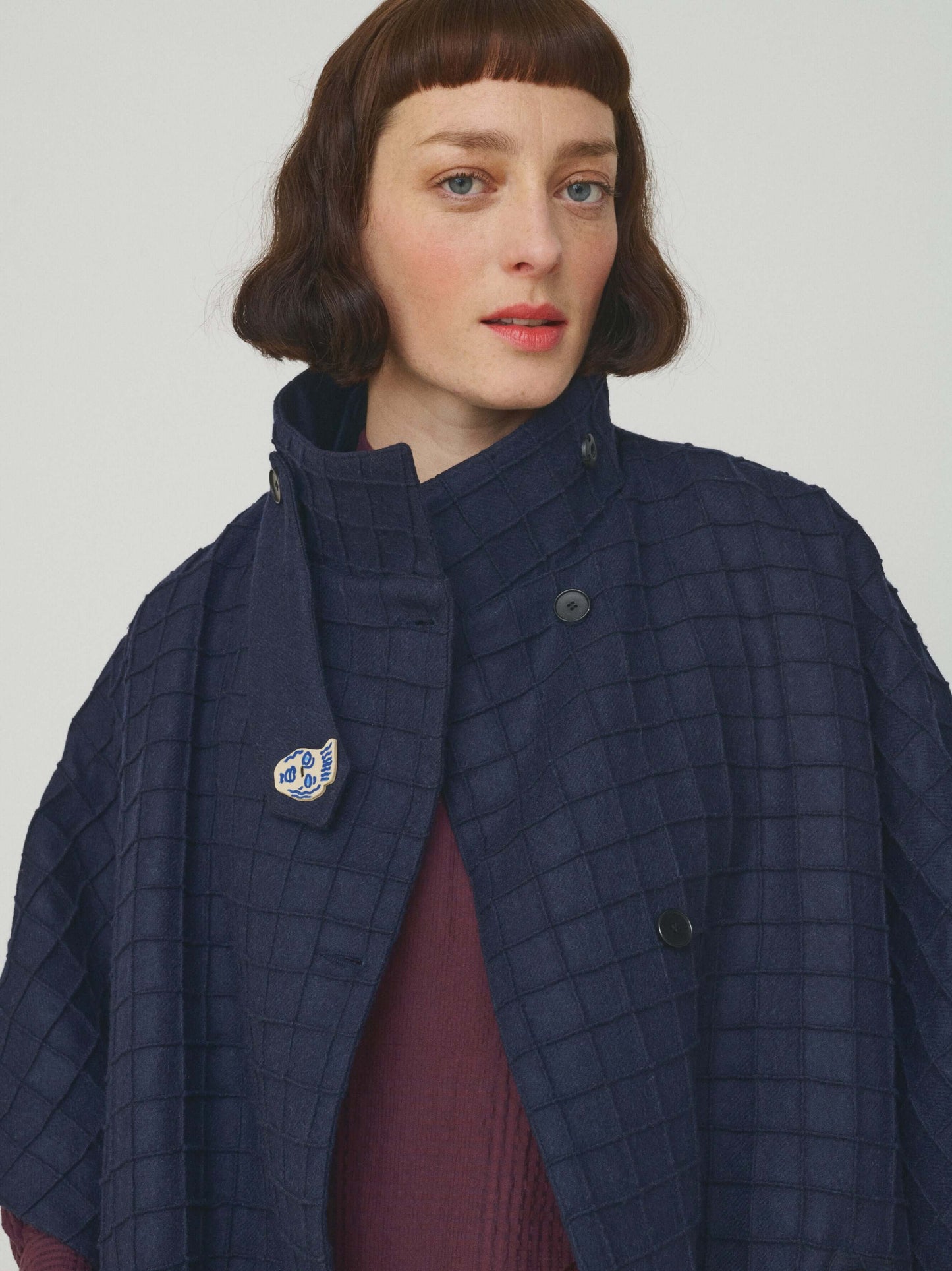 PINTUCK WOOLEN CAPE WITH CERAMIC BUTTONS