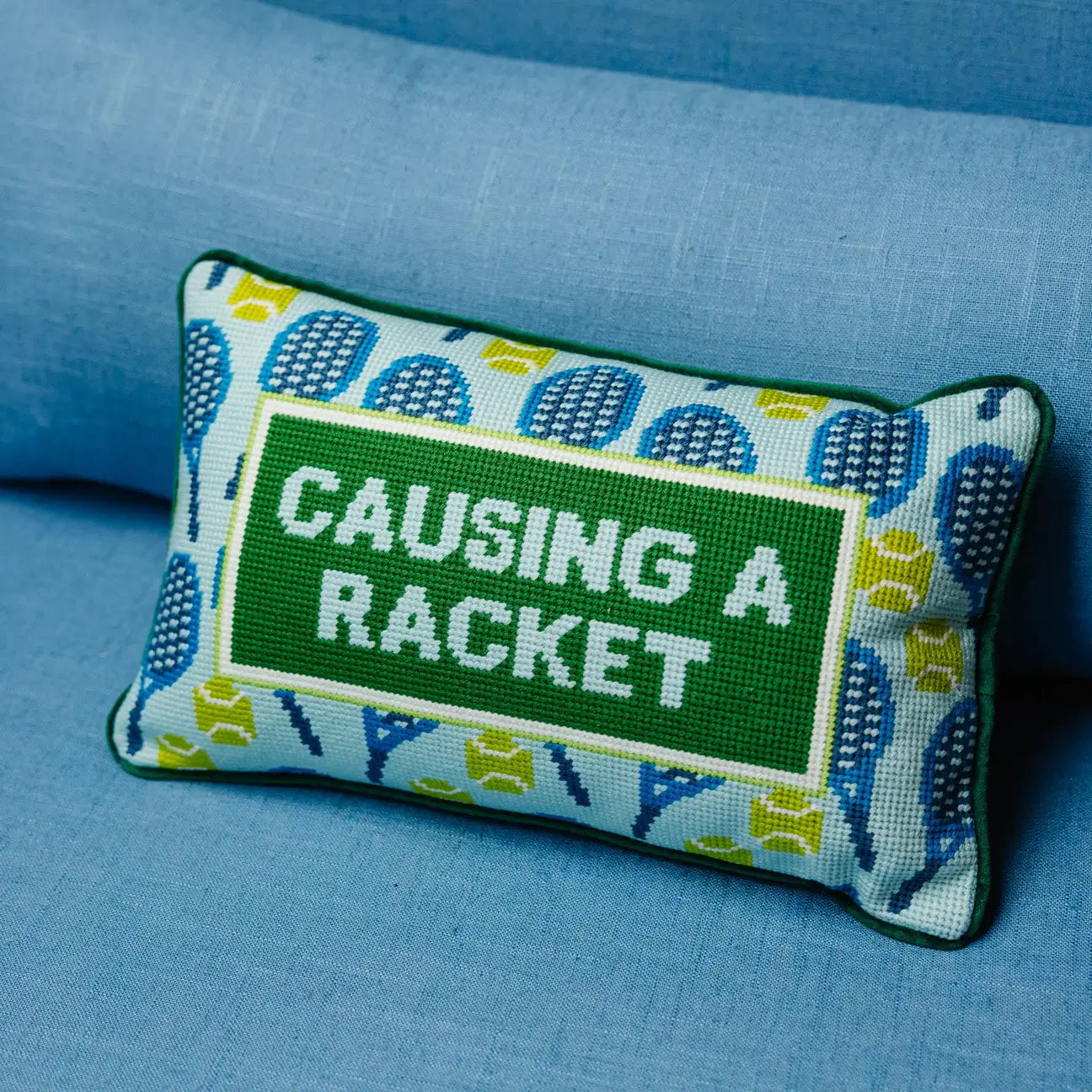 CAUSING A RACKET NEEDLEPOINT PILLOW