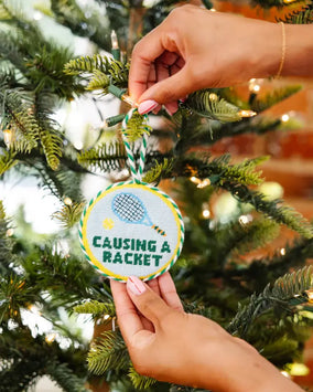 CAUSING A RACKET NEEDLEPOINT ORNAMENT
