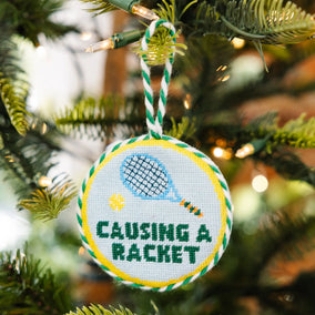 CAUSING A RACKET NEEDLEPOINT ORNAMENT
